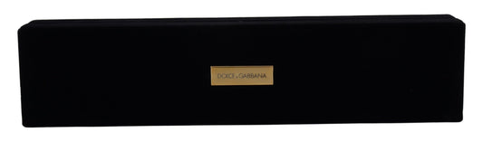 Black rectangular product with a gold label on a white background