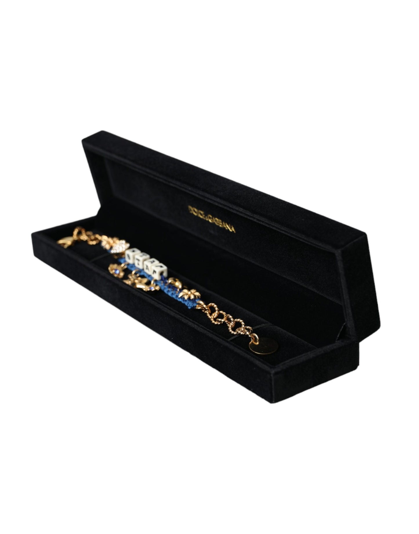 Black jewelry box with gold and silver necklaces inside on a white background