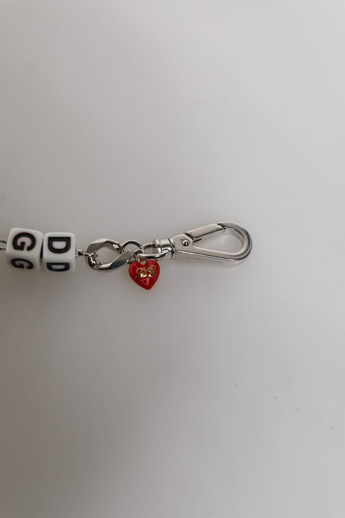 Keychain with heart charm and letter beads on a white background
