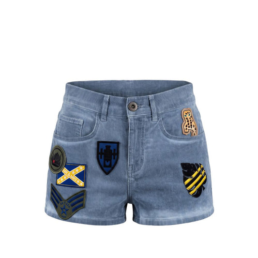Light blue denim shorts with multiple embroidered military-style patches on the front pockets, shown against a plain white background.