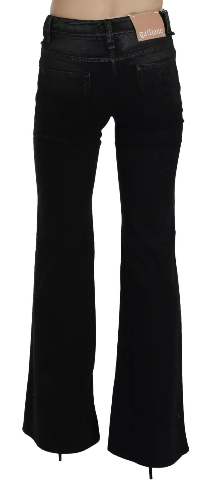 Black flared jeans with a visible brand label on a white background
